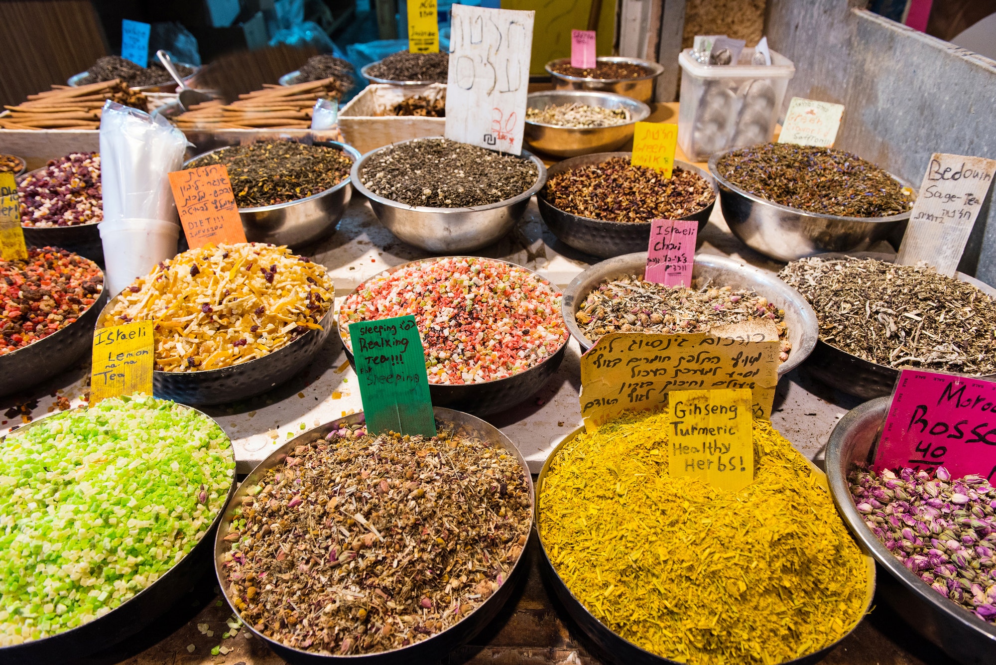 Baskets full with dried fruits, spices and herbs in Mahane Yehuda market. Jerusalem, Israel